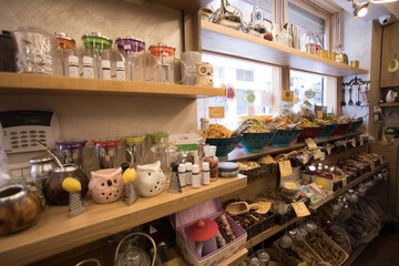 Spices, grains, and ornaments for sale at the market 