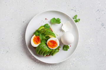 breakfast avocado sandwich with boiled egg