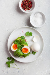 breakfast avocado sandwich with boiled egg