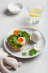 Fototapeta na wymiar breakfast avocado sandwich with boiled egg