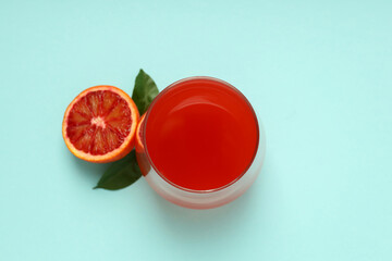 Concept of fresh drink with red orange juice, top view