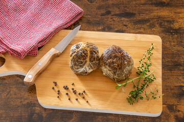 top view of raw caillette on wooden board