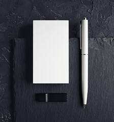 Blank business card, pen and usb flash drive. Mock-up for branding identity. Top view.