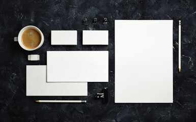 Blank branding stationery set on black plaster background. Template for placing your design....