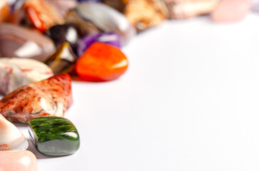 Mineral stones on a white background. The concept of using minerals and crystals in astrology and...