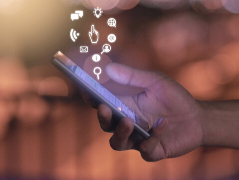 All the tools you need. Cropped shot of an unrecognizable mans hand using a cellphone.