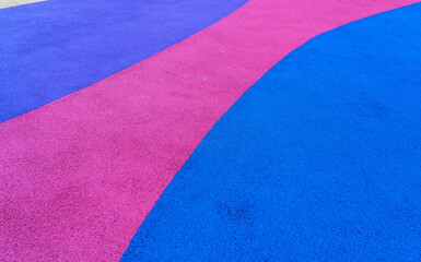 Colorful modern soft flooring made of crumb rubber with cork structure. Texture of surface from...