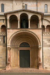 Fototapeta na wymiar Close up of main gate of Duomo in Modena, Italy. This is the most important church in the city.