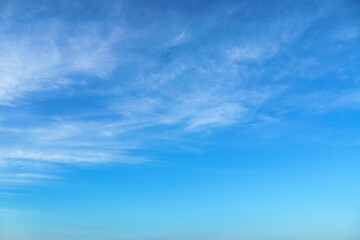 bright blue sky with clouds as abstract background