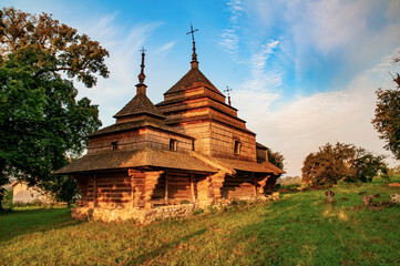 Stunnig view of medieval wooden church of Saint Basil illuminated by morning sun, Cherche, Ukraine