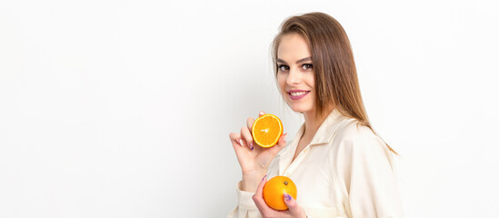 Young Caucasian smiling woman with slices orange over isolated white background