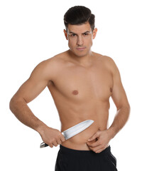 Fototapeta premium Fit man with knife on white background. Weight loss surgery