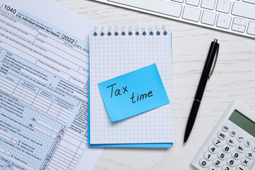 Reminder note with words Tax Time, documents and calculator on white wooden table, flat lay