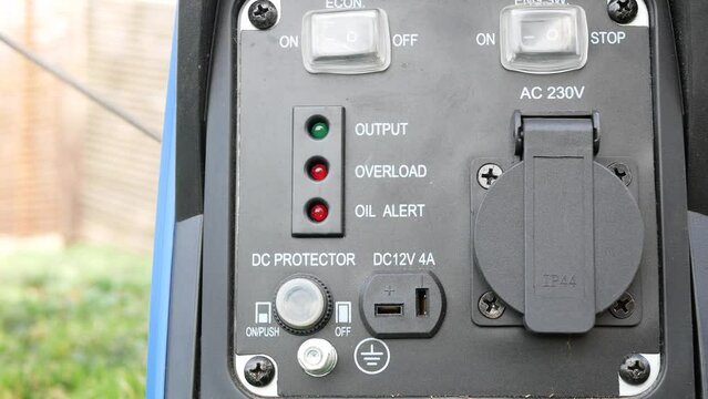 Starting an electric gasoline generator with a cord.  Output voltage indicator lights up.  Source of autonomous power supply