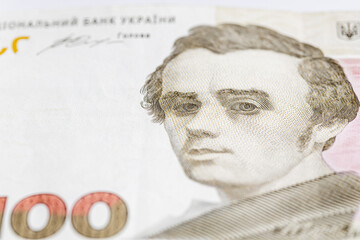 ukrainian financial background. close up 100 uah hryvnia banknote. studio shot