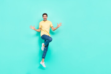 Fototapeta na wymiar Full length portrait of astonished nice person arms palms open mouth isolated on teal color background