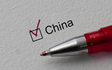 check mark on the word china and red pen. Closeup, concept