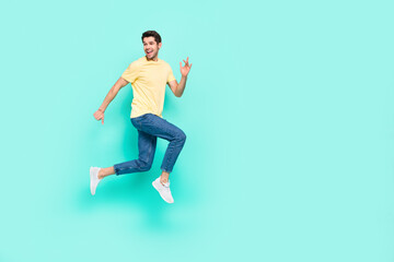 Fototapeta na wymiar Full size profile photo of excited crazy person rush speed look empty space isolated on turquoise color background