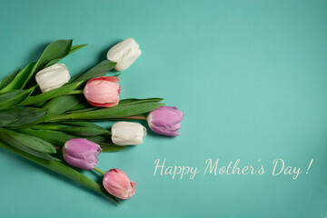 Mothers day card. Tulips white pink purple flowers on turquoise background
