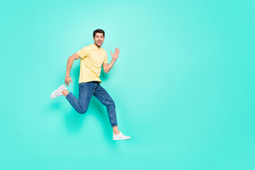 Fototapeta na wymiar Full length profile photo of excited cheerful person hurry running isolated on turquoise color background