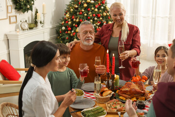 Happy family enjoying festive dinner at home. Christmas celebration