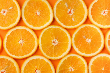 Background of fresh juicy orange slices with pits