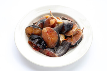 Catfish cut pieces on white background.