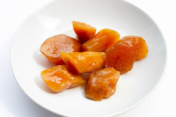 Sweet​ potato​ in syrup on white