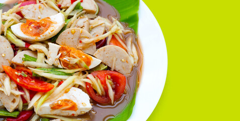 Spicy papaya salad with salted egg and vietnamese pork sausage