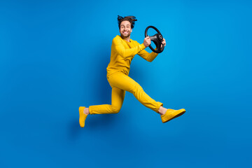 Fototapeta na wymiar Full length body size view of attractive guy jumping driving taxi service isolated over bright blue color background