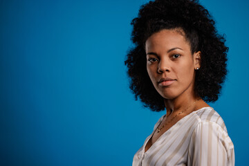 Portrait of concentrated african-american woman, making a serious face,