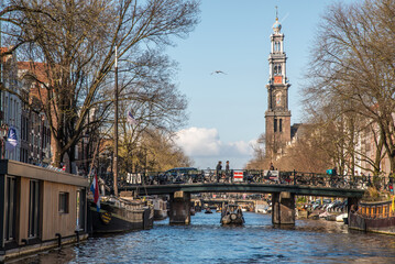 Amsterdam, Netherlands, April 2022. The Prinsengracht in Amsterdam with the Westertoren and houseboats.