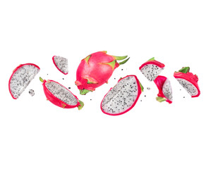 Whole and chopped red dragon fruits (pitahaya) in the air on a white background