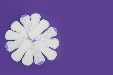 women's sanitary pads on a purple background very peri