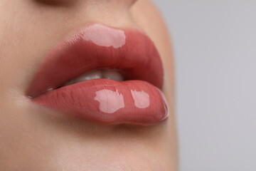 Closeup view of beautiful young woman with perfect lips makeup on light grey background - obrazy, fototapety, plakaty