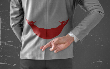 Businessman Jacket with Flag of Easter Island with his fingers crossed behind his back