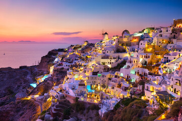Oia village, Santorini, Greece. View of traditional houses in Santorini. Small narrow streets and...