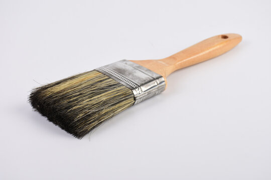 Clean new paint brush isolated on white background.