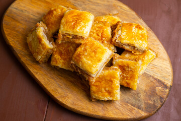 Baked pastry on a wooden board traditional desert
