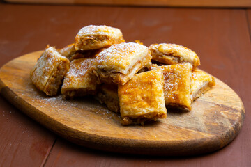 baked pastry on a wooden board