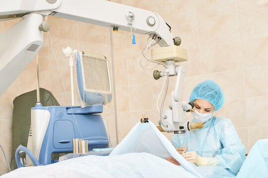 Ophthalmology laser microscope operation. Doctor surgery in clinic. Patient eye treatment. Myopia and cataract removal. Medical vision prp lasik