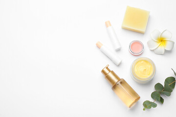 Flat lay composition with beeswax cosmetics on white background. Space for text