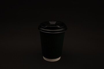 Disposable coffee cup with plastic lid