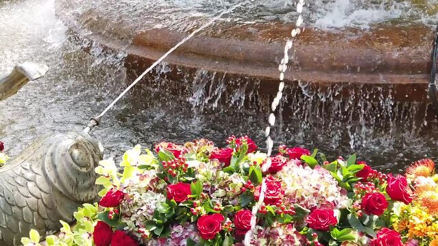 TIMFLORALIS international flower festival held in Timisoara, Romania. Details of a pubic fountain with flower decorations