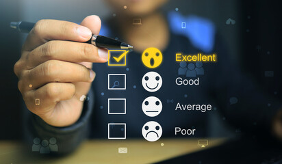 The men's hands holding the black pen were evaluating merchant services or online transactions with the highest score being Excellent out of four.