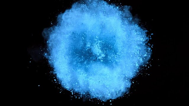 Super Slow Motion Shot of Rotating Blue Powder Expolosion Isolated on Black Background at 1000fps.