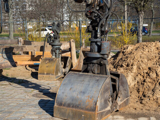 Excavator at a construction site in the city.