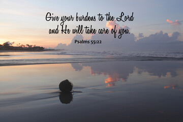 Bible verse inspirational quote - Give your burdens to the Lord and He will take care of you. Psalms 55:22 On tranquil morning light sunrise on the beach. Believe surrender to God concept.
