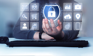 Woman showing a security interface concept. Internet of things. Cybersecurity concept. Icon shield with a lock symbol. Protection against dangers.