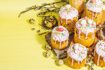 Traditional Easter cake. Festive sweet food with icing and decor. Eggs, nest, willow